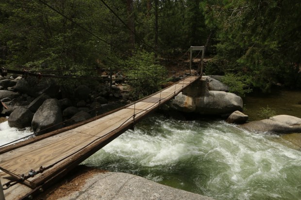 A visit to Wawona is not complete without a walk over the South Fork of the Merced River on the Swinging Bridge. Photo: Theresa Ho