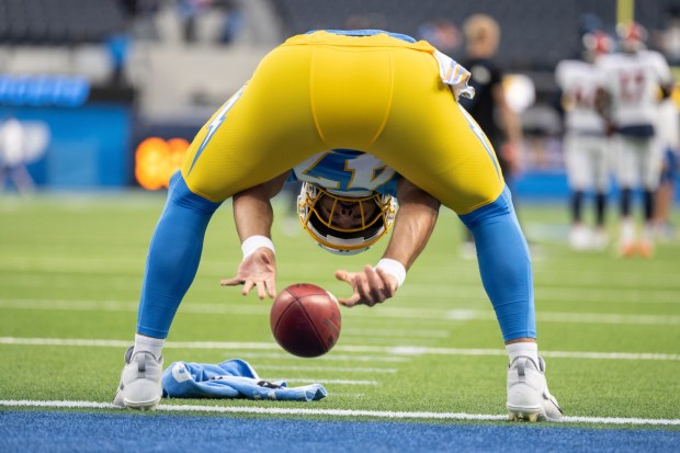 Los Angeles Chargers long snapper Josh Harris (47) snaps the ball before an NFL football game against the Denver Broncos, Monday, Oct. 17, 2022, in Inglewood, Calif. (AP Photo/Kyusung Gong)