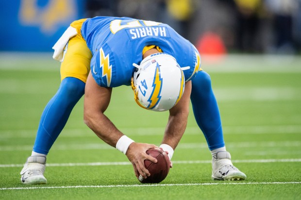 Los Angeles Chargers long snapper Josh Harris (47) warms up before an NFL football game against the Miami Dolphins, Sunday, Dec. 11, 2022, in Inglewood, Calif. (AP Photo/Kyusung Gong)