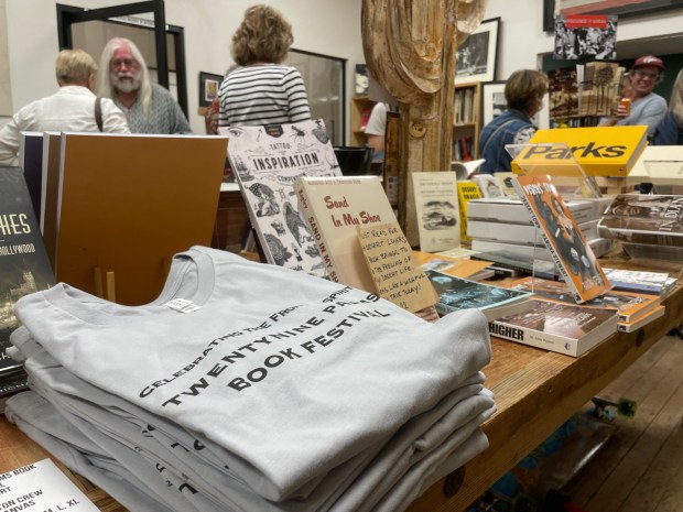 Book lovers gather at Corner 62, a general store in Twentynine Palms, where books by featured authors from the Desert Book Festival were displayed, authors signed books and festival shirts were for sale. (Photo by David Allen, Inland Valley Daily Bulletin/SCNG)