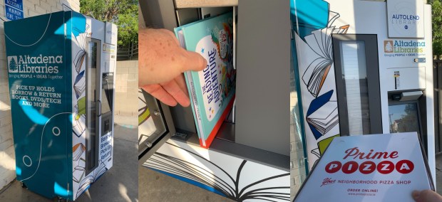 Checking out the Altadena Library District's new book machine outside the Prime Pizza parlor. (Photo by Erik Pedersen/SCNG)