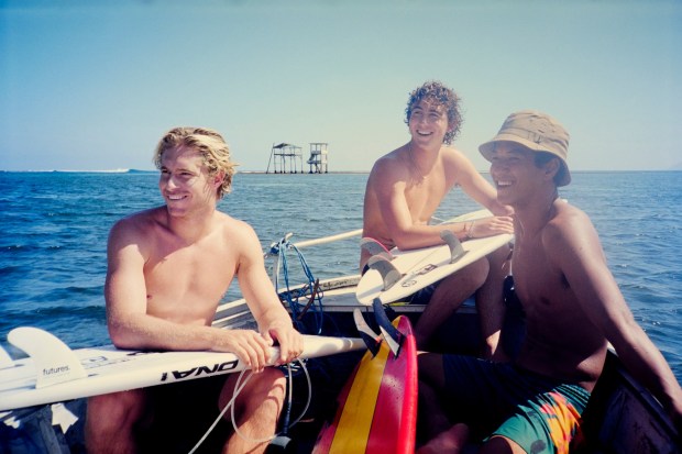 Ethan Ewing sits with Hawaiian Seth Moniz and San Clemente's Griffin Colapinto, in the back of the boat, for the film Trilogy The New Era premiering at the Coast Film & Music Festival in Laguna Beach. (Photo courtesy of Coast Film & Music Festival)