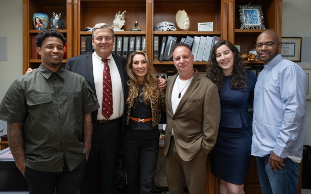 Attorney Annee Della Donna, center, with Dupree Glass, far left, and Juan Rayford, far right, and her team who helped get the falsely convicted men freed from prison after they served nearly 17 years for attempted murder. Retired detective Daniel Mulrenin, from left, Innocence OC co-CEO Eric Dubin, and lawyer Madeline Knutson, who was a UC Irvine law student at the time, gather in Laguna Beach onSaturday, August 5, 2023. (Photo by Mindy Schauer, Orange County Register/SCNG)