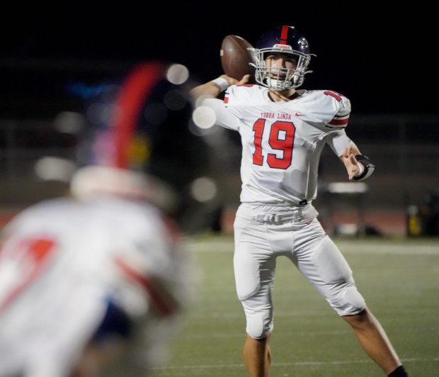 Yorba Linda's Holden Nagin passes during the game between Yorba Linda vs. Foothill in a Crestview League football game at Tustin High School on Thursday, October 26, 2023. (Photo by Michael Kitada, Contributing Photographer)