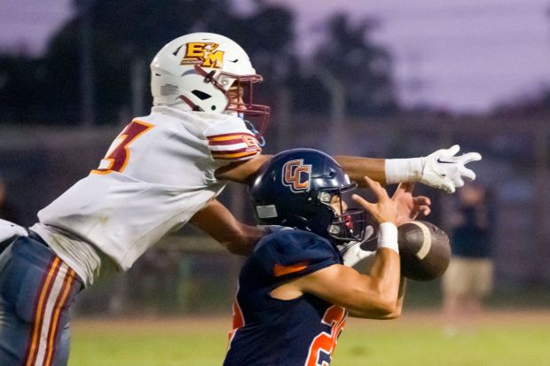 Connor Smith (3) of El Modena breaks up the pass to Matthew Baldonado (29) of Cypress in a football game at Western High School in Anaheim on Thursday, August 31, 2023. (Photo by Leonard Ortiz, Orange County Register/SCNG)