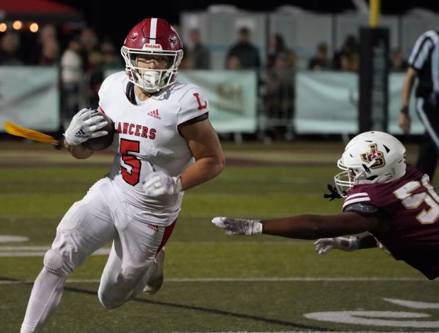 Running back Steve Chavez eludes the JSerra High defense in the game between Orange Lutheran vs. JSerra in a Trinity League football game at JSerra in San Juan Capistrano, on Friday, September 29, 2023.. (Photo by Michael Kitada, Contributing Photographer)
