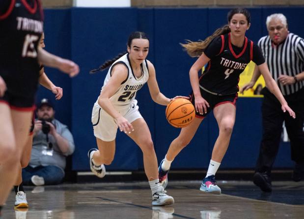 San Juan Hills' Aryanna Hudson brings the ball up the court during a South Coast League game against San Clemente on Thursday, February 2, 2023. (Photo by Jeff Antenore, Contributing Photographer)