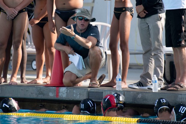 Foothill head coach Jim Brumm talks to his team during a non-league boys water polo game against Newport Harbor at Foothill High in Santa Ana on Tuesday, Sept. 10, 2019. Newport Harbor defeated Foothill 14-8. (Photo by Kevin Sullivan, Orange County Register/SCNG)