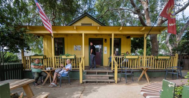 Customers sit on the porch and at tables in the yard of the Hidden House Coffee located on Los Rios Street in San Juan Capistrano, just a few steps from the train station, on Wednesday, September 27, 2023. (Photo by Mark Rightmire, Orange County Register/SCNG)