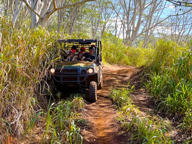 Japanese tourists have a blast ATVing on the North Shore. (Photo by David Dickstein)