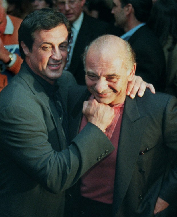 Sylvester Stallone, left, mugs with "Rocky" co-star Burt Young before a screening of the 1976 film to celebrate its 20th anniversary, Nov. 15, 1996, in Beverly Hills, Calif. (AP Photo/Chris Pizzello, File)