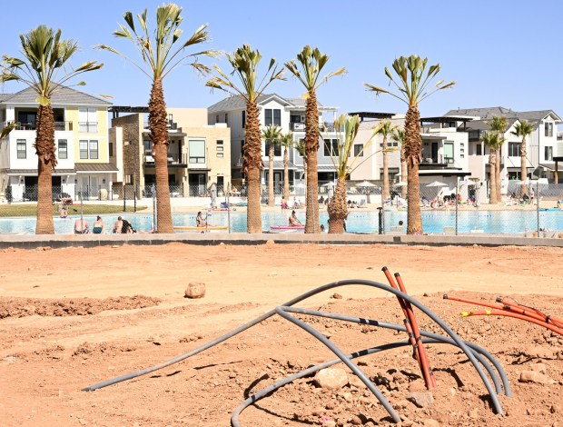 Construction continues at a community surrounding a large beach like pool called Desert Color in St. George, Utah, on April 15, 2023. The U.S. Geological Survey shows that residents of Washington County, where St. George is located, use an average of 306 gallons of water each day. In contrast, Phoenix residents use 111 gallons per day. (Photo by RJ Sangosti/The Denver Post)