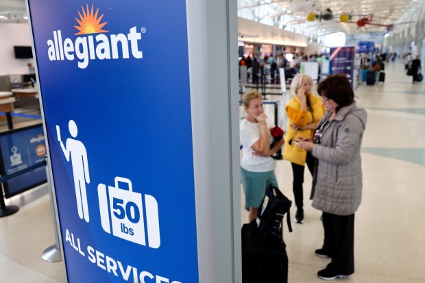 Passengers stand at the Allegiant Airlines ticketing area at Fort Lauderdale-Hollywood International Airport in Fort Lauderdale on Thursday, Nov. 2, 2023. (Amy Beth Bennett / South Florida Sun Sentinel)