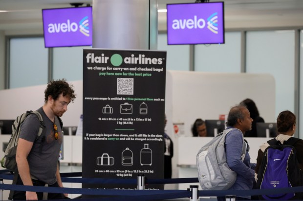 Passengers line up for service at the Avelo and Flair Airlines ticket counters at Fort Lauderdale-Hollywood International Airport in Fort Lauderdale on Thursday, Nov. 2, 2023. (Amy Beth Bennett / South Florida Sun Sentinel)